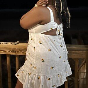 white dress with sunflower detailing